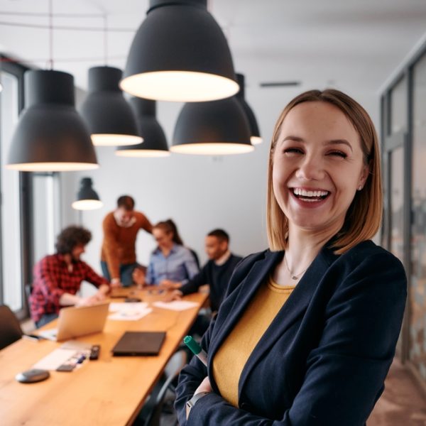 Confident,Blonde,Businesswoman,Leading,Team,In,Modern,Office,Setting.